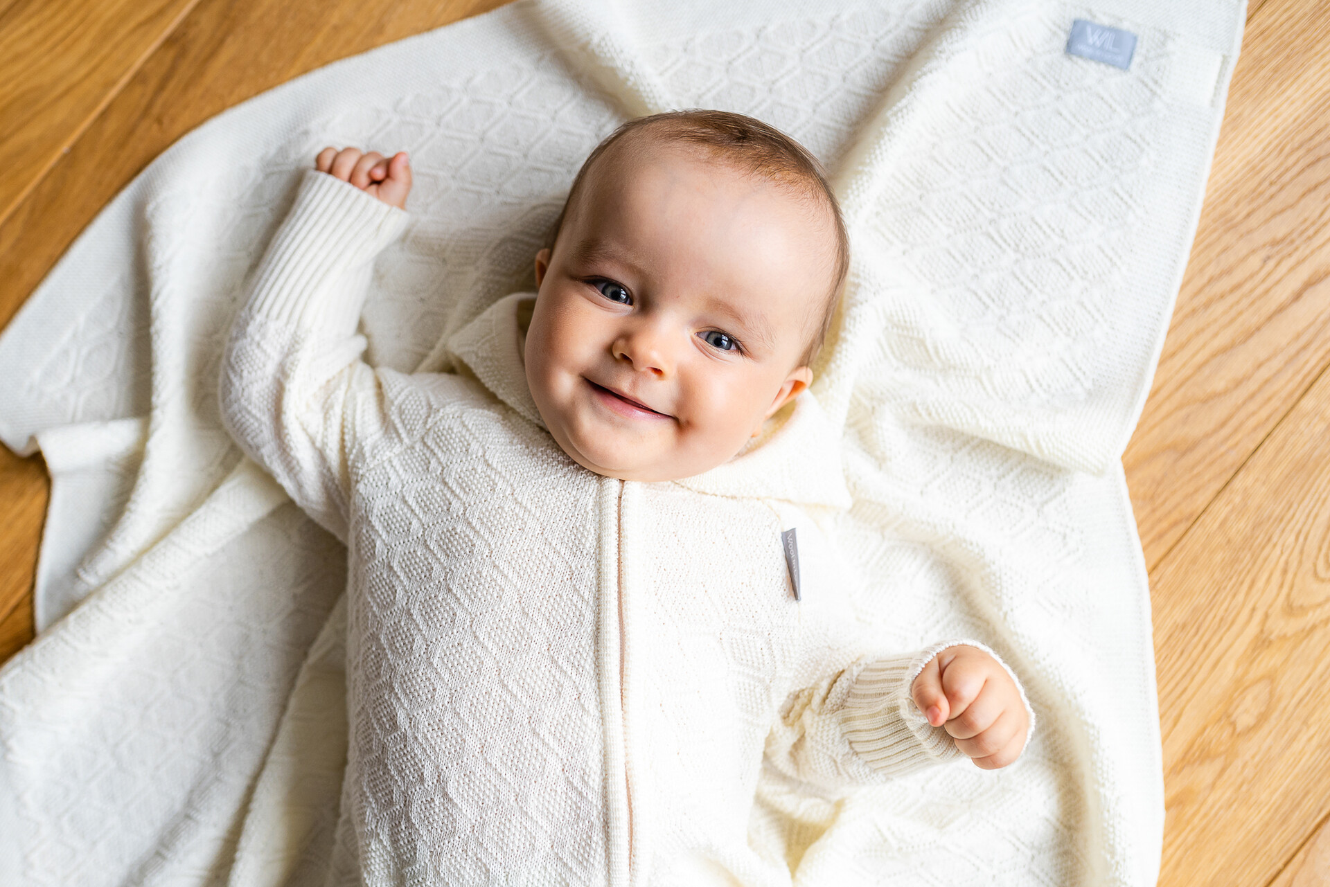 Warm and soft merino wool baby blanket with a luxurious diamond pattern. 