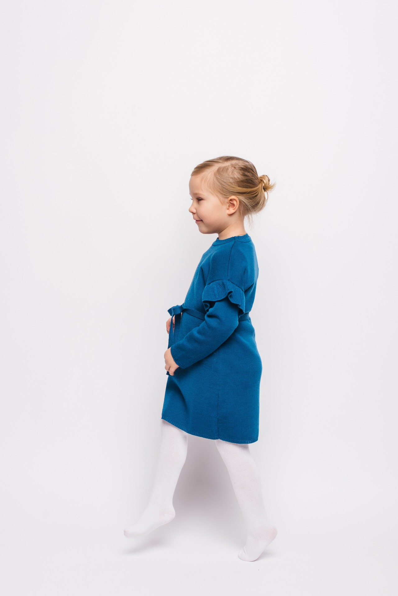 kids merino dress with modest design, Sleeves are decorated with ruche details.